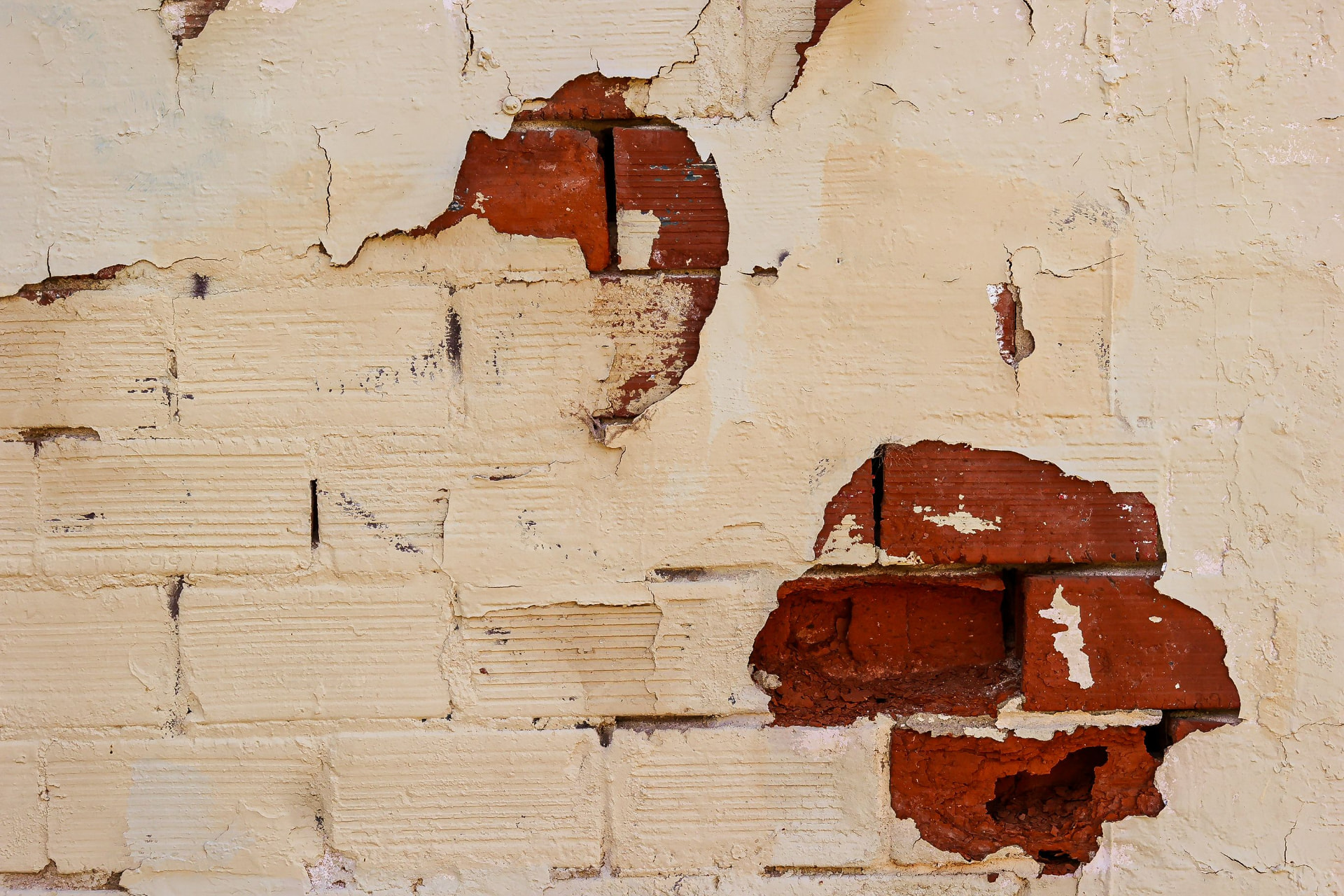 Brick wall with peeling render
